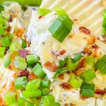 Loaded chip dip is an easy and quick dip recipe made with sour cream, cream cheese, crispy bacon, cheddar cheese, ranch seasoning and green onion that’s perfect for a party, tailgate, or any night of the week and is ready in less than 20 minutes.