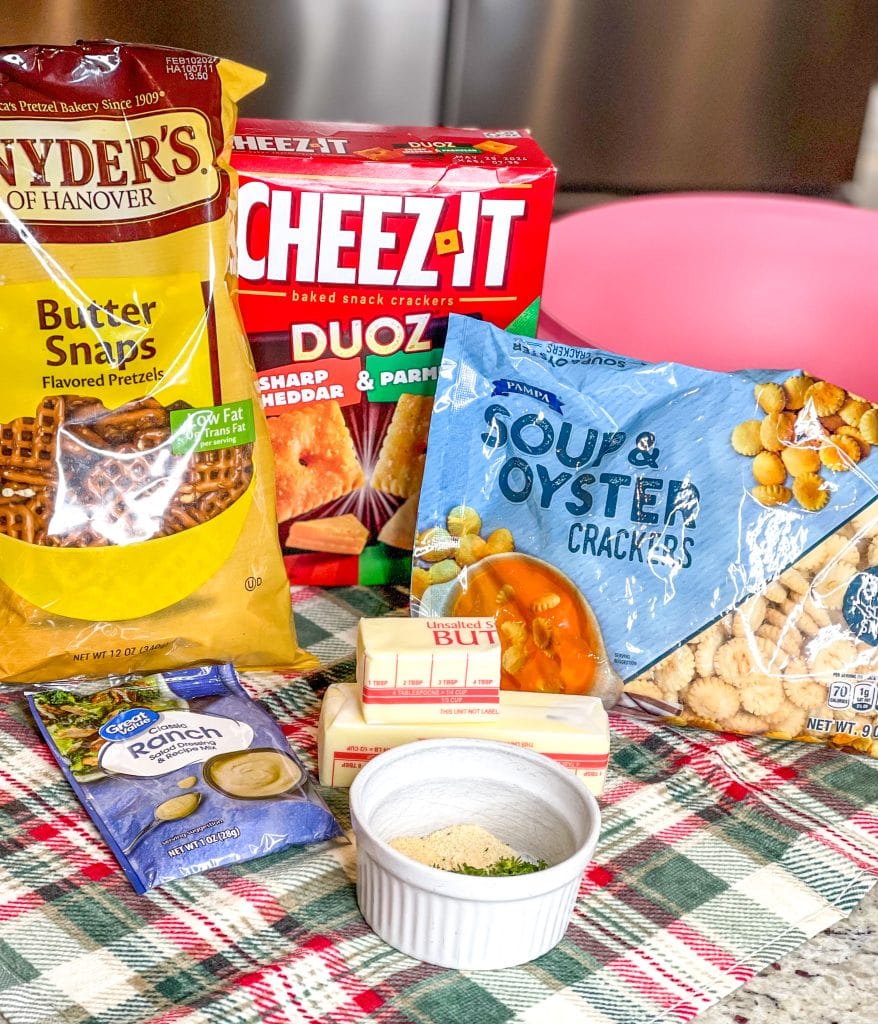 Cheez-it snack mix made with a combination of Parmesan and Cheddar Cheez-Its, oyster crackers, square pretzel snaps tossed in a buttery ranch and dill seasoning and baked to perfection. Perfect for a party!