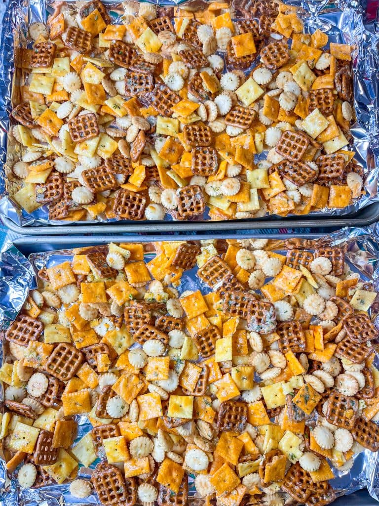 Cheez-it snack mix made with a combination of Parmesan and Cheddar Cheez-Its, oyster crackers, square pretzel snaps tossed in a buttery ranch and dill seasoning and baked to perfection. Perfect for a party!