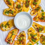 Boursin Cheese Pepper Poppers are my go-to snack to make for game day! Mini sweet peppers are stuffed with savory Boursin cheese and sharp cheddar cheese, baked until gooey, and topped with crisp bacon and bright green onions for the perfect cheesy bite.