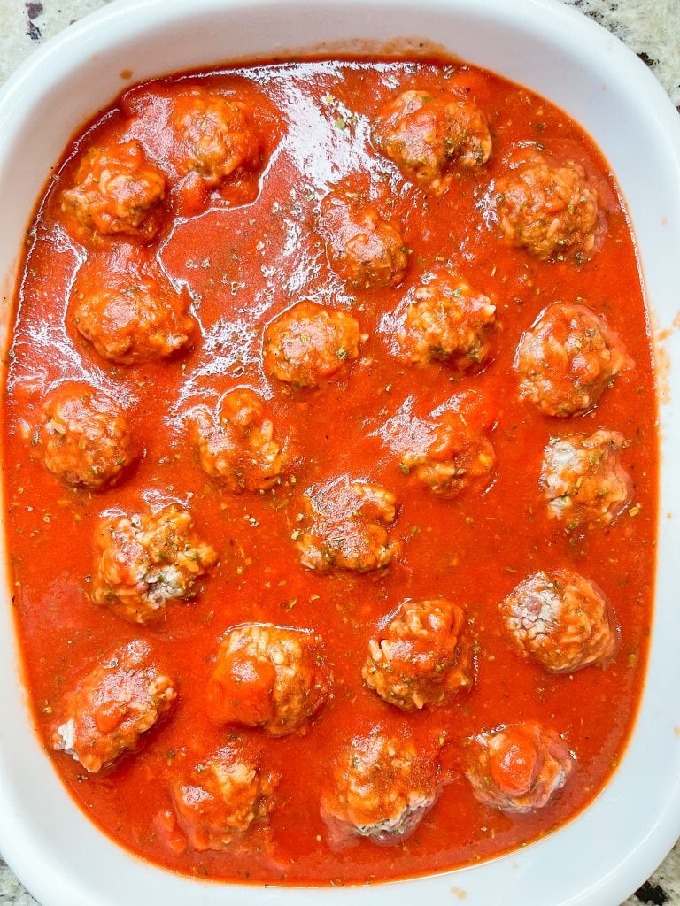 Porcupine meatballs are juicy and tender meatballs made with rice, ground beef, and seasonings in a tangy tomato sauce, all baked in one dish in the oven. These scrumptious meatballs are easy, kid friendly and a perfect weeknight dinner served alongside mashed potatoes and your favorite vegetables. #easydinner #meatballs #kidfriendy #Stephgigliotti #onedishmeal