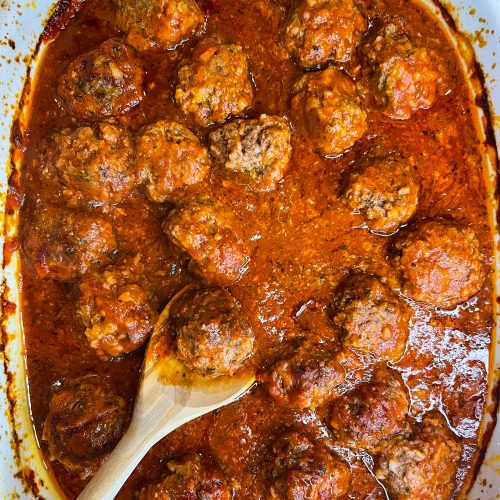 Porcupine meatballs are juicy and tender meatballs made with rice, ground beef, and seasonings in a tangy tomato sauce, all baked in one dish in the oven. These scrumptious meatballs are easy, kid friendly and a perfect weeknight dinner served alongside mashed potatoes and your favorite vegetables. #easydinner #meatballs #kidfriendy #Stephgigliotti #onedishmeal