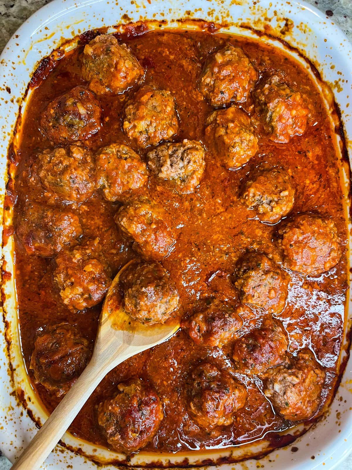 Porcupine meatballs are juicy and tender meatballs made with rice, ground beef, and seasonings in a tangy tomato sauce, all baked in one dish in the oven. These scrumptious meatballs are easy, kid friendly and a perfect weeknight dinner served alongside mashed potatoes and your favorite vegetables. #easydinner #meatballs #kidfriendy #Stephgigliotti #onedishmeal