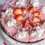 Chocolate Covered strawberry pie is a luscious no bake dessert with an Oreo crust, a layer of fudge and a creamy strawberry filling. Perfect for Valentine's day or any party or holiday.