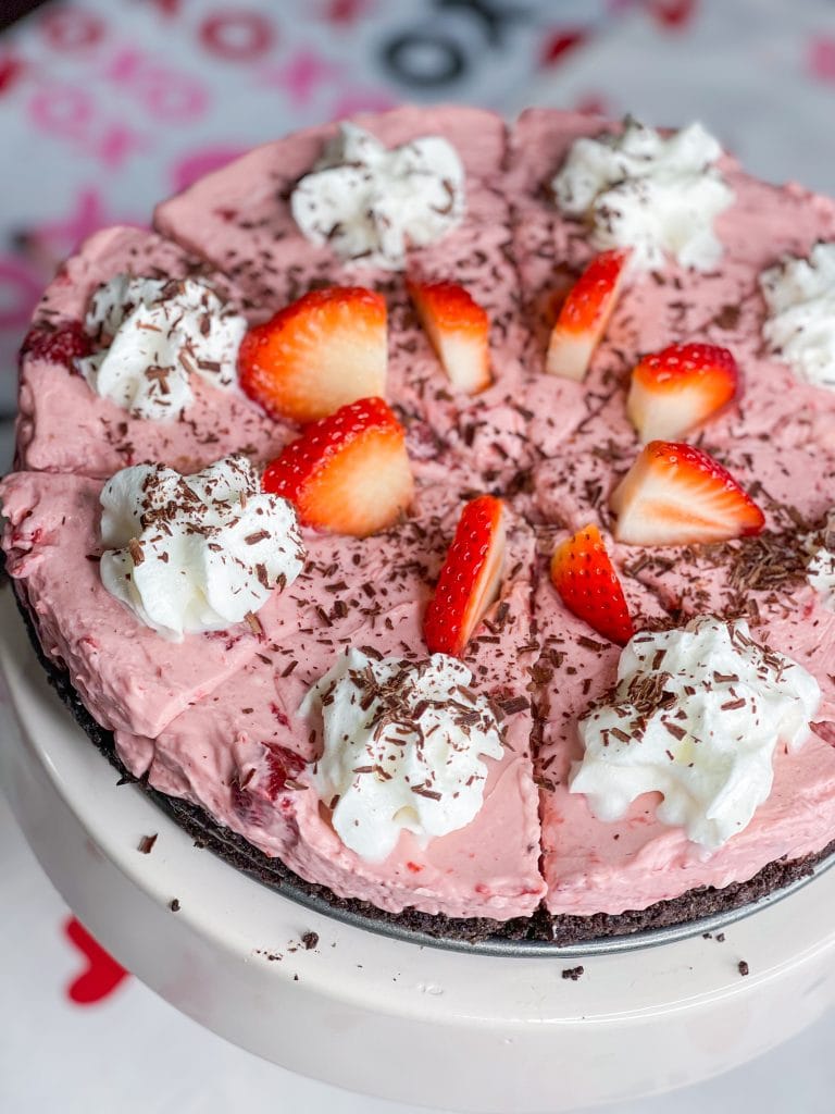 Chocolate Covered strawberry pie is a luscious no bake dessert with an Oreo crust, a layer of fudge and a creamy strawberry filling. Perfect for Valentine's day or any party or holiday. 