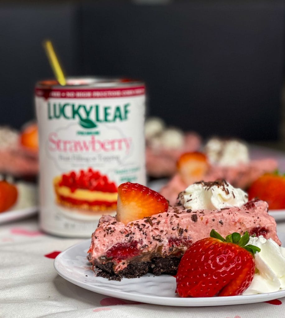 Chocolate Covered strawberry pie is a luscious no bake dessert with an Oreo crust, a layer of fudge and a creamy strawberry filling. Perfect for Valentine's day or any party or holiday.