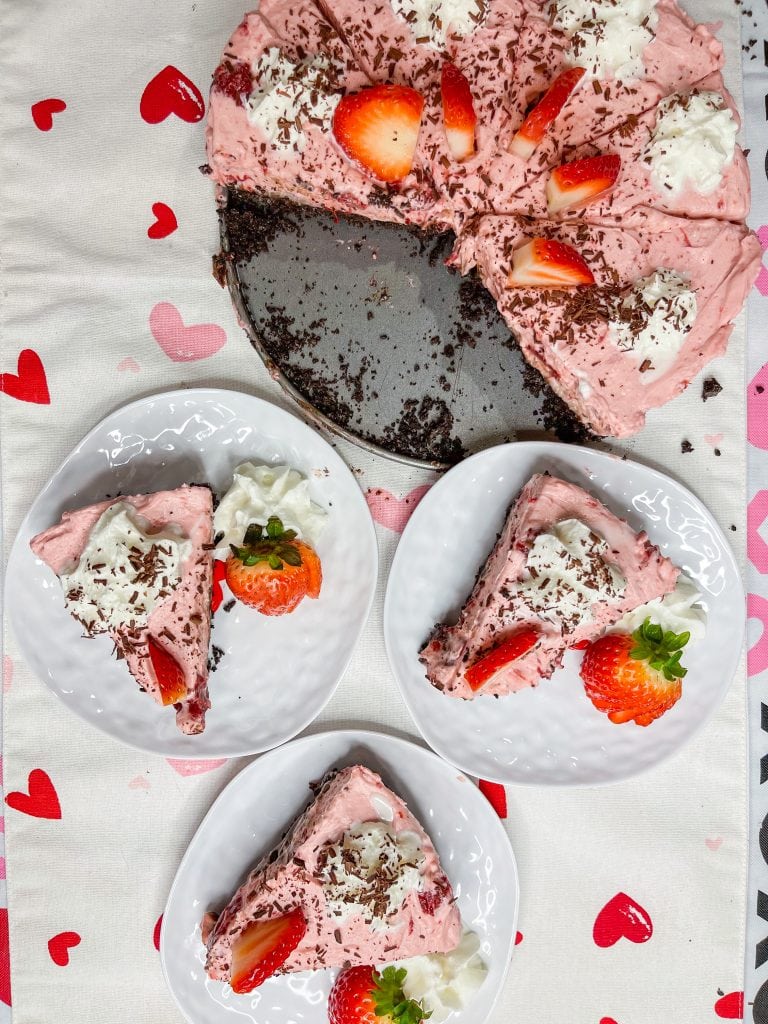 Chocolate Covered strawberry pie is a luscious no bake dessert with an Oreo crust, a layer of fudge and a creamy strawberry filling. Perfect for Valentine's day or any party or holiday.