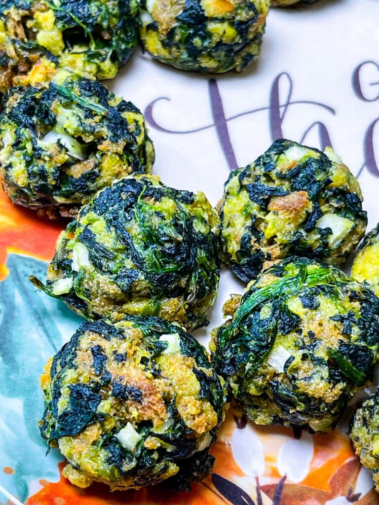 Spinach Balls are a simple, make ahead appetizer! They are delicious warm or room temperature. Spinach Balls can be frozen and pulled out anytime for effortless entertaining.