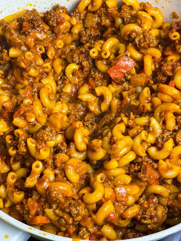 Old Fashioned American Goulash is an easy 30 minute meal, cooked in one pot with macaroni, tomato sauce, and ground beef. It's hearty and delicious and a quick weeknight dinner.