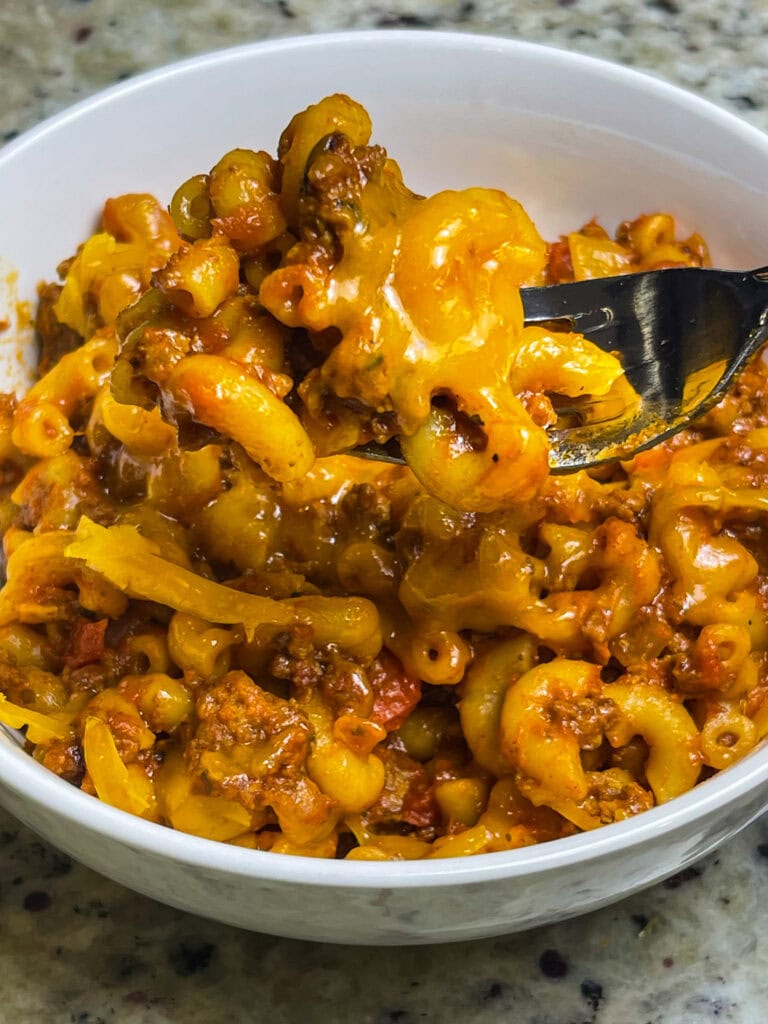 Old Fashioned American Goulash is an easy 30 minute meal, cooked in one pot with macaroni, tomato sauce, and ground beef. It's hearty and delicious and a quick weeknight dinner.