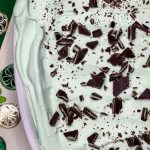 Andes Mint Poke Cake is a fudgy chocolate cake topped with a minty whipped cream and Andes mint candies. This easy poke cake is perfect for St Patrick's Day or for anyone who loves mint!