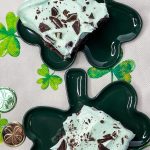 Andes Mint Poke Cake is a fudgy chocolate cake topped with a minty whipped cream and Andes mint candies. This easy poke cake is perfect for St Patrick's Day or for anyone who loves mint!