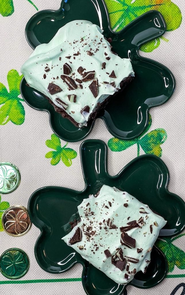 Andes Mint Poke Cake is a fudgy chocolate cake topped with a minty whipped cream and Andes mint candies. This easy poke cake is perfect for St Patrick's Day or for anyone who loves mint!