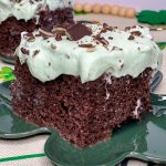 Andes Mint Poke Cake is a fudgy chocolate cake topped with a minty whipped cream and Andes mint candies. This easy poke cake is perfect for St Patrick's Day or for anyone who loves mint!