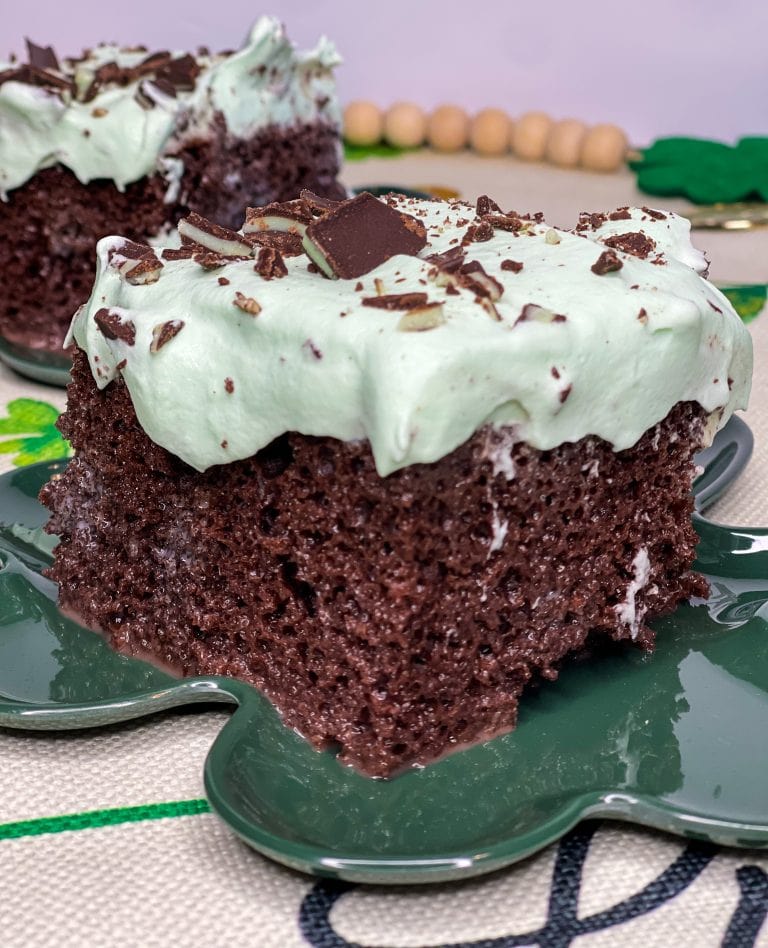 Andes Mint Poke Cake is a fudgy chocolate cake topped with a minty whipped cream and Andes mint candies. This easy poke cake is perfect for St Patrick's Day or for anyone who loves mint!