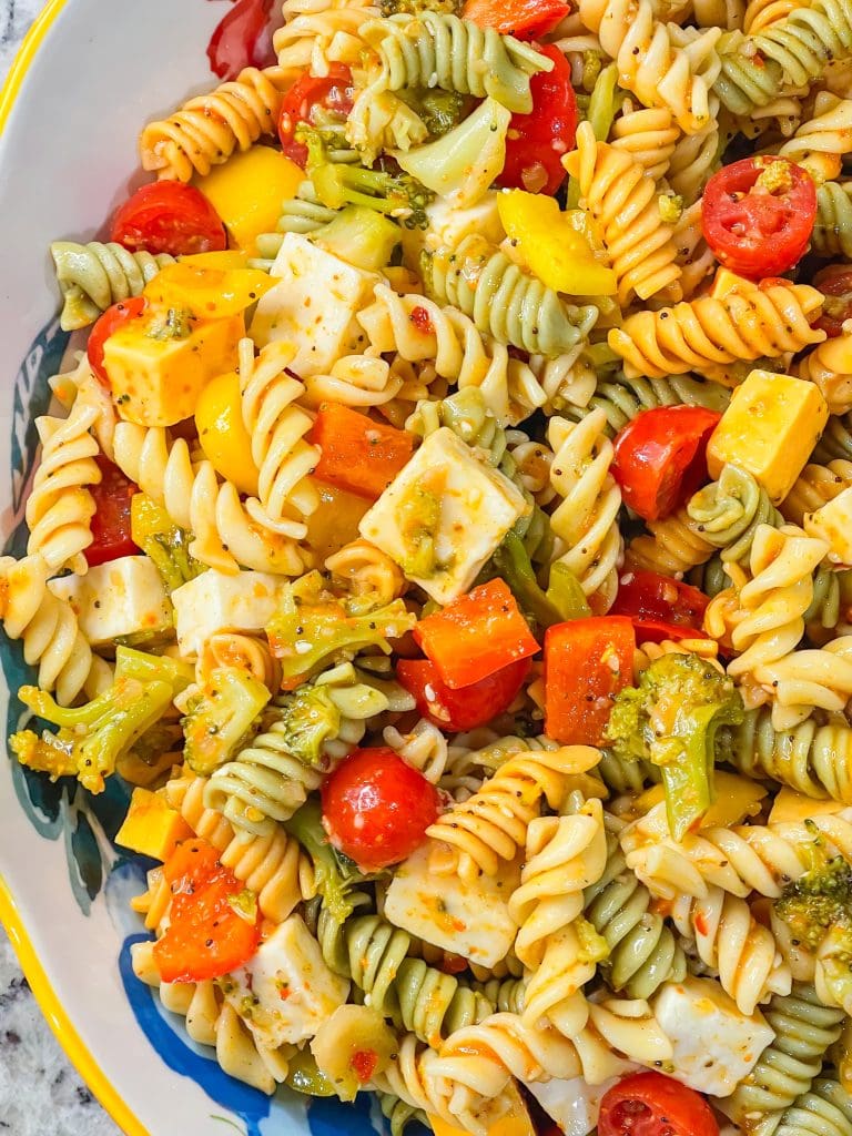 This pasta salad is a combination of rotini pasta, chunky cheeses, veggies zesty Italian dressing and seasoning is just amazing! Great for any get-together or summer picnic.