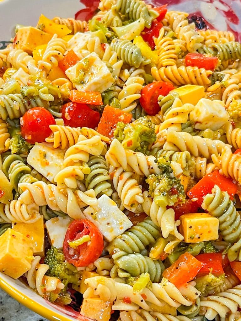 This pasta salad is a combination of rotini pasta, chunky cheeses, veggies zesty Italian dressing and seasoning is just amazing! Great for any get-together or summer picnic.