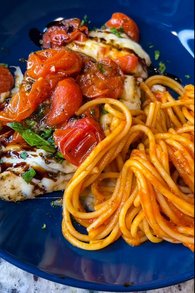 Love sheet pan dinners? This is for you! Sheet Pan Italian Style Chicken is super easy and super flavorful. Sweet roasted tomatoes top juicy, cheesy chicken and it's finished off with fresh herbs and a drizzle of balsamic vinegar. The perfect week night meal.