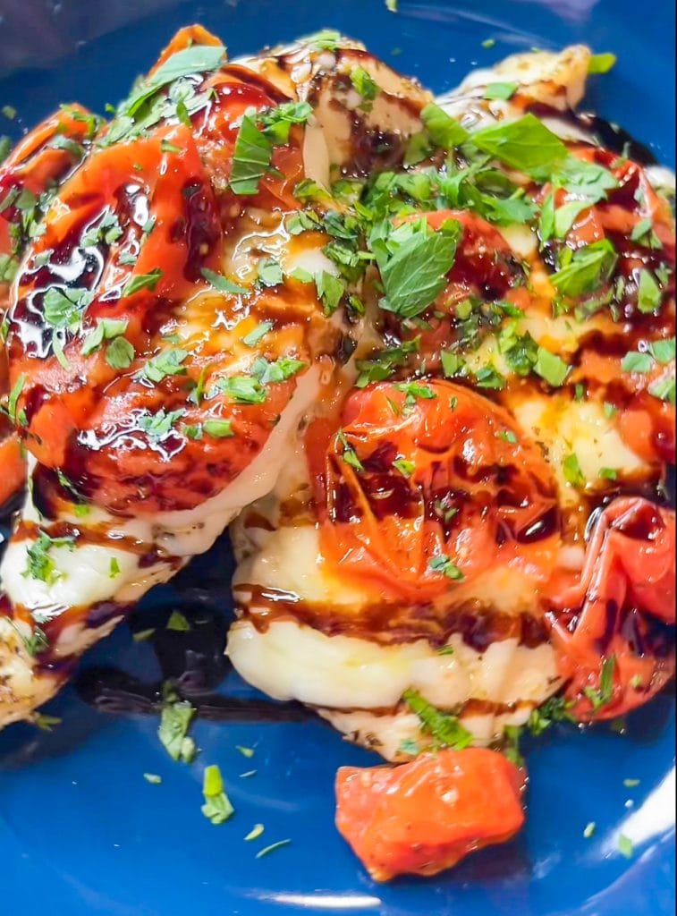 Love sheet pan dinners? This is for you! Sheet Pan Italian Style Chicken is super easy and super flavorful. Sweet roasted tomatoes top juicy, cheesy chicken and it's finished off with fresh herbs and a drizzle of balsamic vinegar. The perfect week night meal.