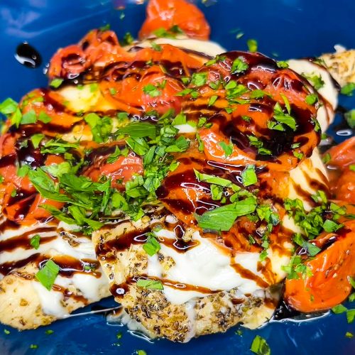 Love sheet pan dinners? This is for you! Sheet Pan Italian Style Chicken is super easy and super flavorful. Sweet roasted tomatoes top juicy, cheesy chicken and it's finished off with fresh herbs and a drizzle of balsamic vinegar. The perfect week night meal.