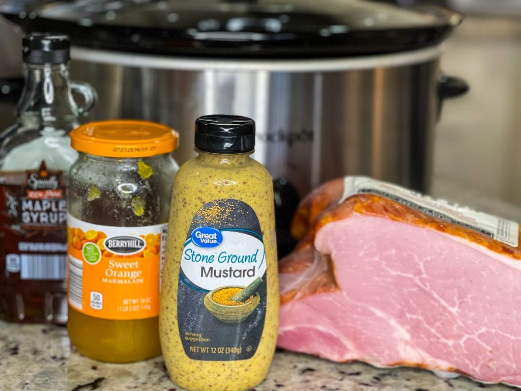 Easy and delicious, this slow cooker glazed ham is just 5 simple ingredients for a juicy ham dinner.