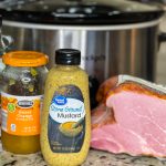 Easy and delicious, this slow cooker glazed ham is just 5 simple ingredients for a juicy ham dinner.