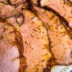 Easy and delicious, this slow cooker glazed ham is just 5 simple ingredients for a juicy ham dinner.