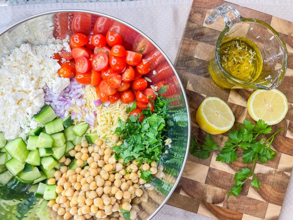 This Orzo Salad is light and refreshing, but healthy and still delicious. It's full of protein from the chickpeas and feta cheese, crunch from cucumbers, has healthy fat and is super flavorful from the dressing.