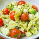 This pasta salad is one of my favorites! I really could eat it every day in the summer. Tender pasta, juicy tomatoes, fresh mozzarella, zesty red onion, and basil are coated in a creamy avocado vinaigrette. This pasta salad has all the flavors of summer.