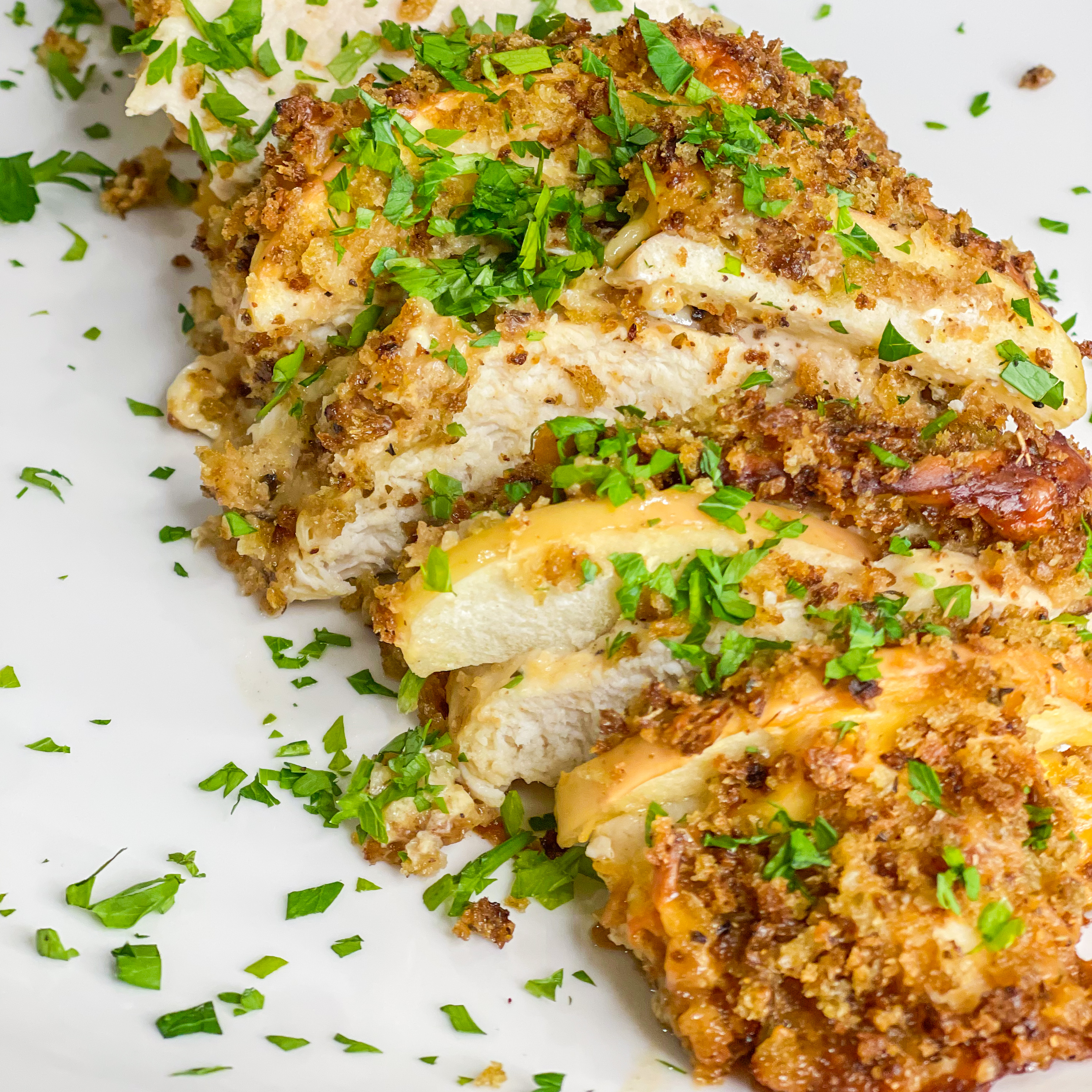 Hasselback chicken is so easy to make, but it looks so fancy! It's chicken breast cut hasselback style, then stuffed with the perfect pairing of gouda cheese and sliced gala apples. But it doesn't stop there! The chicken is topped with a panko breadcrumb mixture and when baked gives the chicken a nice crunch in every bite.