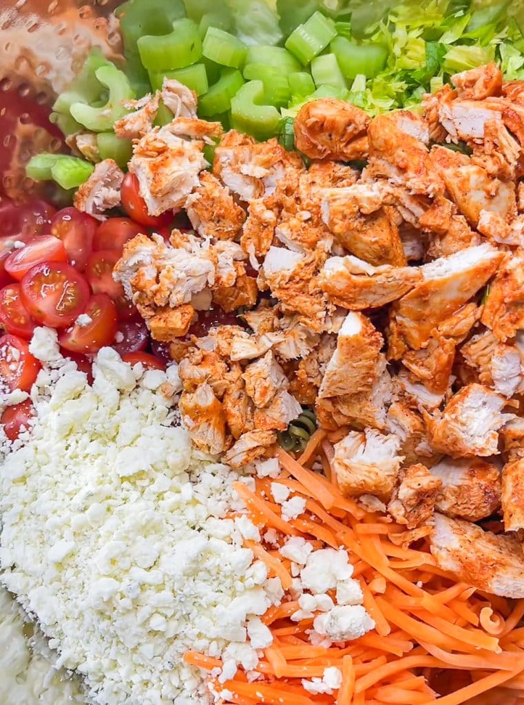 Buffalo Chicken Pasta Salad is spicy and cool with a creamy buffalo ranch sauce mixed with crunchy carrots and celery with a bite of blue cheese. Perfect for any summer occasion.