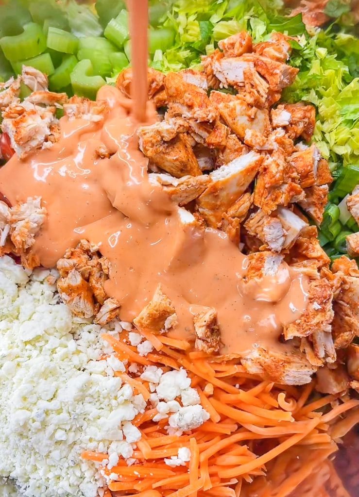 Buffalo Chicken Pasta Salad is spicy and cool with a creamy buffalo ranch sauce mixed with crunchy carrots and celery with a bite of blue cheese. Perfect for any summer occasion.