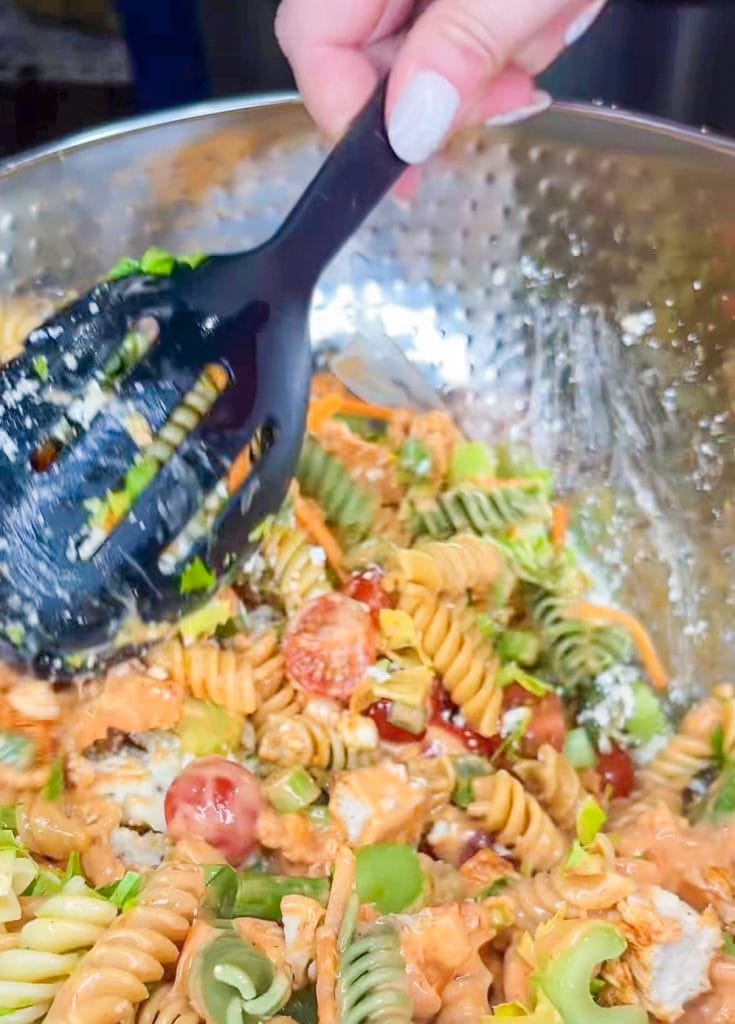 Buffalo Chicken Pasta Salad is spicy and cool with a creamy buffalo ranch sauce mixed with crunchy carrots and celery with a bite of blue cheese. Perfect for any summer occasion.