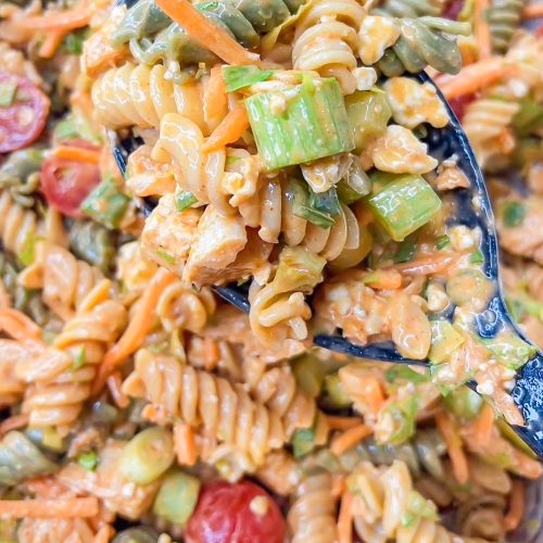 Buffalo Chicken Pasta Salad is spicy and cool with a creamy buffalo ranch sauce mixed with crunchy carrots and celery with a bite of blue cheese. Perfect for any summer occasion. StephRealLife.com