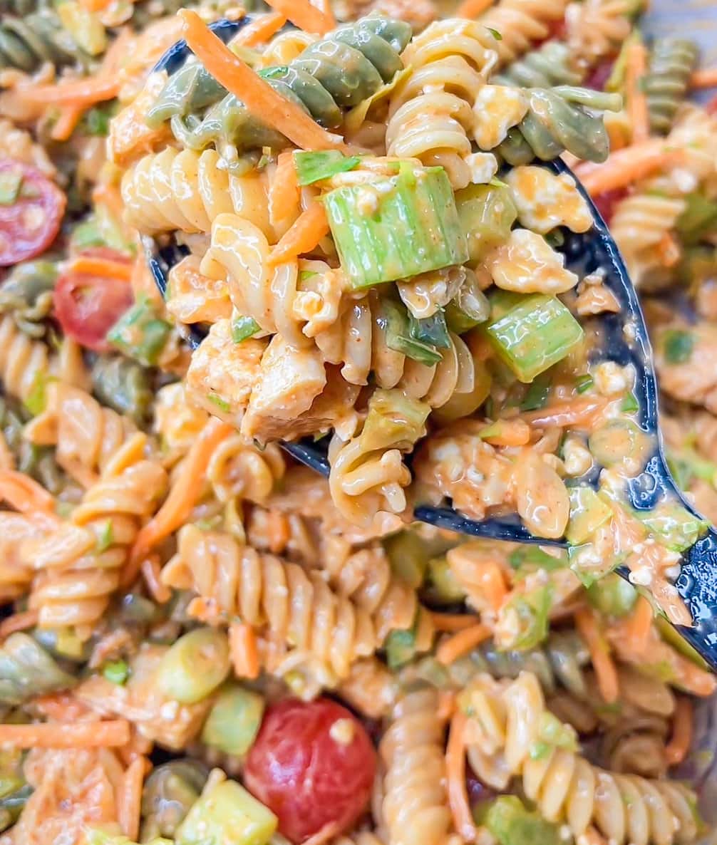 Buffalo Chicken Pasta Salad is spicy and cool with a creamy buffalo ranch sauce mixed with crunchy carrots and celery with a bite of blue cheese. Perfect for any summer occasion. StephRealLife.com