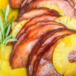 This slow cooked ham is just 6 simple ingredients; a boneless or bone-in spiral ham, brown sugar, canned pineapple, maple syrup, butter and a dash of cloves. Plus, it's a dump-and-go recipe, minimal effort and little clean up required. That is my type of meal!