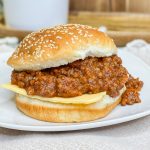 Easy Slow Cooker Sloppy Joes are a childhood favorite and makes a big batch to feed a crowd. The meat and sauce meld together, slow cooking for hours, for a flavorful nostalgic dish.