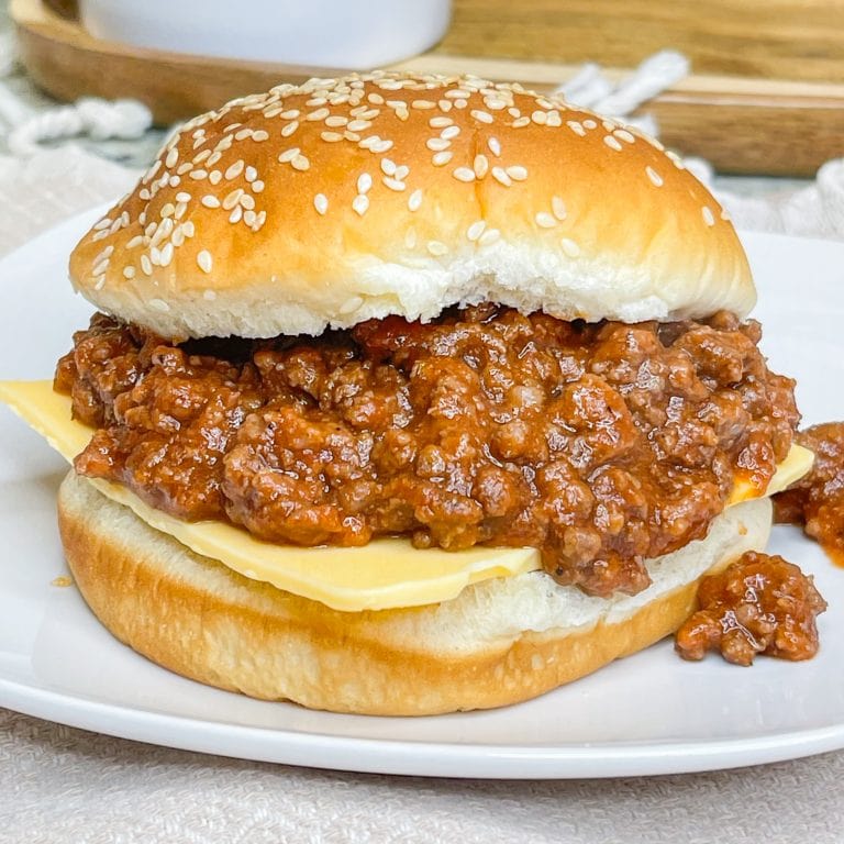 Easy Slow Cooker Sloppy Joes are a childhood favorite and makes a big batch to feed a crowd. The meat and sauce meld together, slow cooking for hours, for a flavorful nostalgic dish.