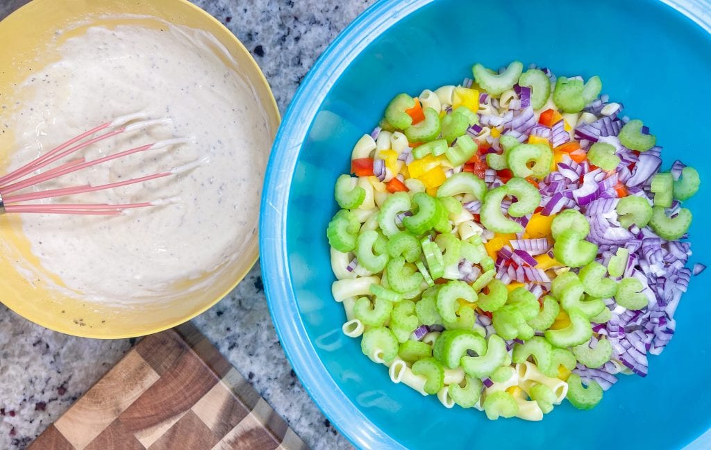 Classic Macaroni Salad is the ultimate side dish of the summer and is invited to all the BBQ's! It's creamy, crunchy, and so simple to prepare.