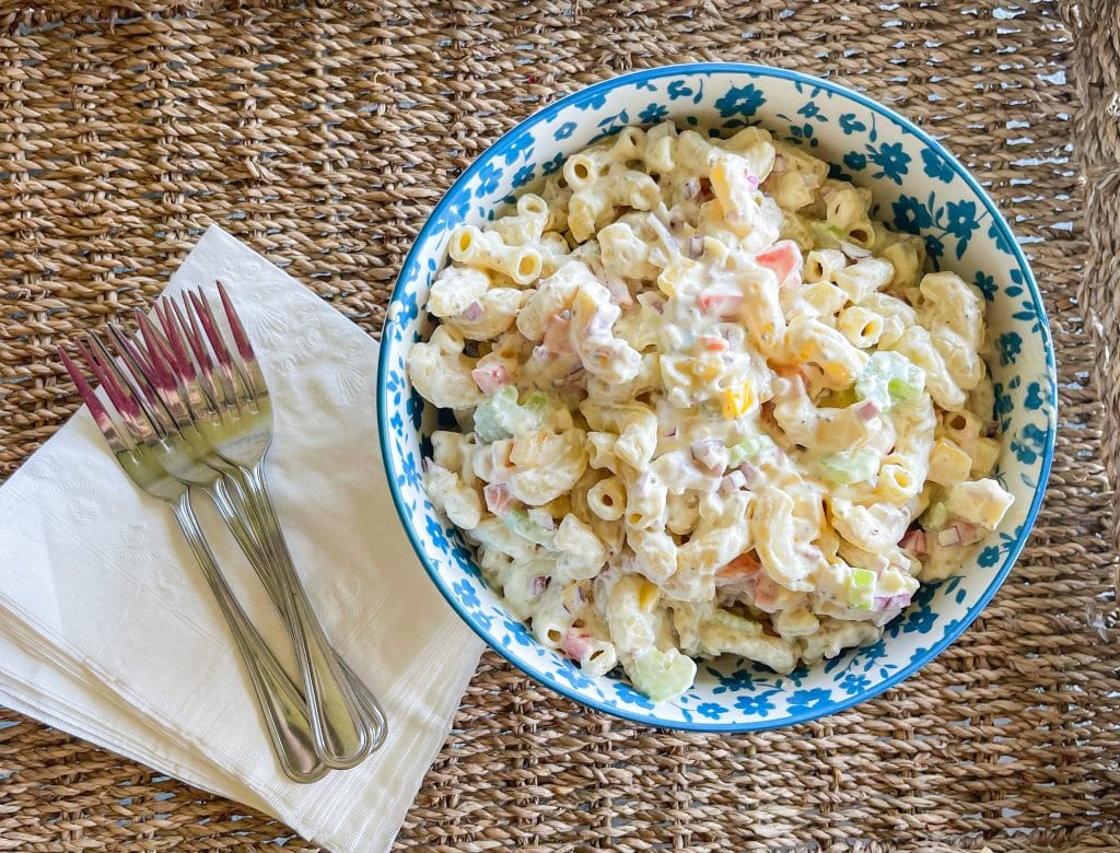 Classic Macaroni Salad is the ultimate side dish of the summer and is invited to all the BBQ's! It's creamy, crunchy, and so simple to prepare.