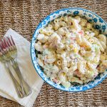 Classic Macaroni Salad is the ultimate side dish of the summer and is invited to all the BBQ's! It's creamy, crunchy, and so simple to prepare.