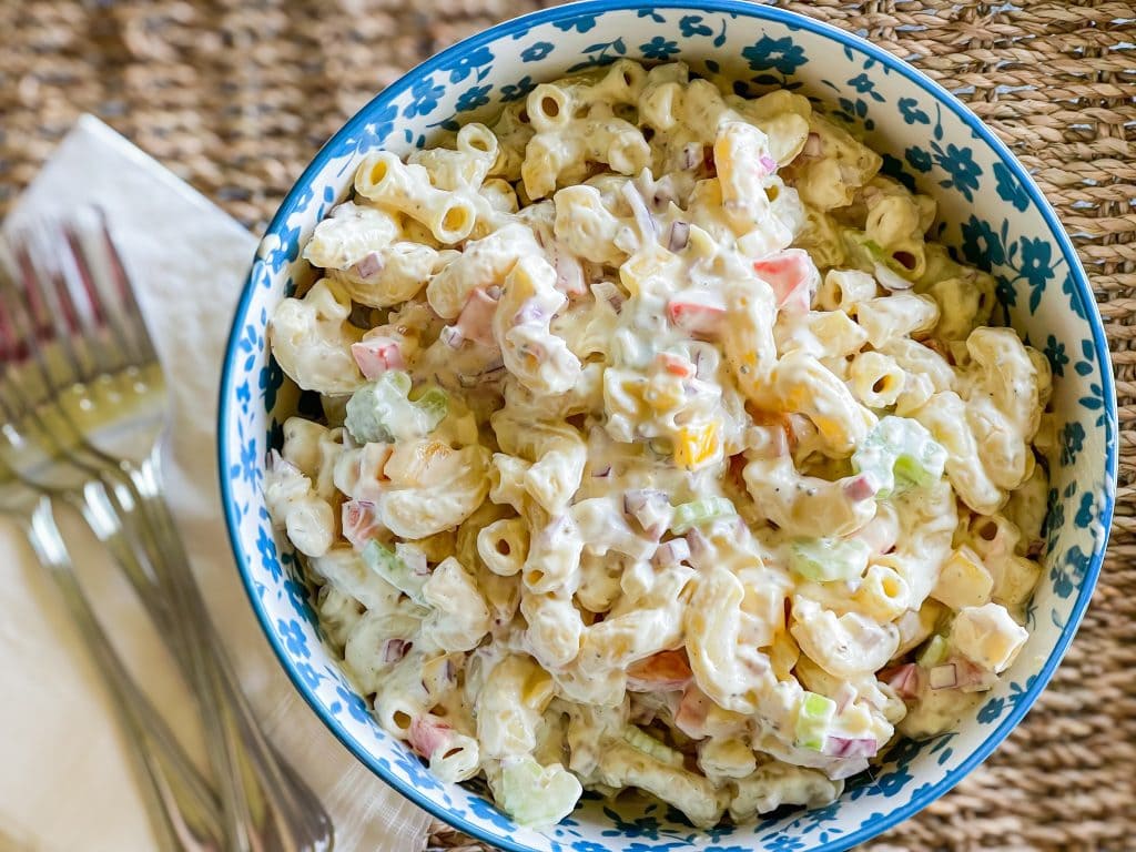 Classic Macaroni Salad is the ultimate side dish of the summer and is invited to all the BBQ's! It's creamy, crunchy, and so simple to prepare. 