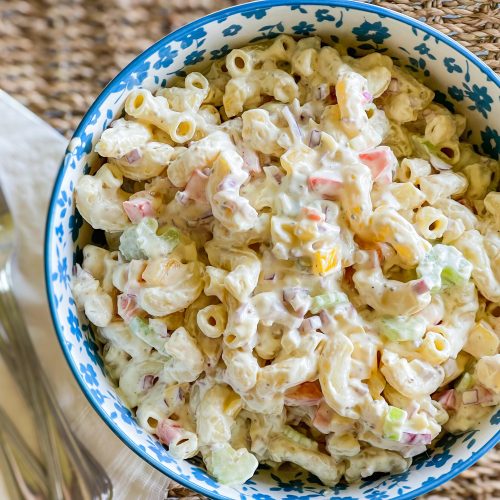 Classic Macaroni Salad is the ultimate side dish of the summer and is invited to all the BBQ's! It's creamy, crunchy, and so simple to prepare.