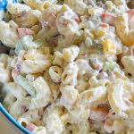 Classic Macaroni Salad is the ultimate side dish of the summer and is invited to all the BBQ's! It's creamy, crunchy, and so simple to prepare.