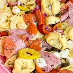 Love Italian subs? You will absolutely LOVE this Italian Sub Pasta Salad made with Italian meats, mozzarella cheese, tortellini, and veggies in an Italian vinaigrette. This pasta salad will make you the star of any get-together.