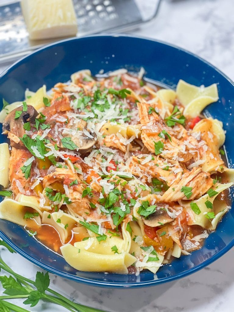 Juicy chicken smothered in a flavorful mushroom tomato sauce, Slow Cooker Chicken Cacciatore is a comfort dish that's easy enough for a weeknight dinner.