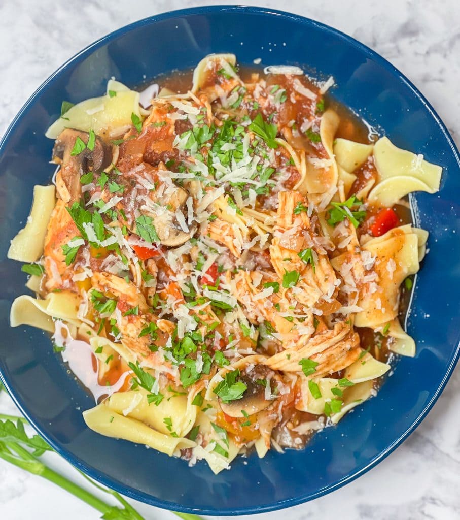 Juicy chicken smothered in a flavorful mushroom tomato sauce, Slow Cooker Chicken Cacciatore is a comfort dish that's easy enough for a weeknight dinner.