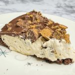 Just a few simple ingredients to this mouth-watering chocolate and peanut butter pie with a Reese's Peanut Butter Cups topping. And it's quick! If you are a fan of chocolate and peanut butter together, this is a must make! The perfect chilled pie for any occasion.