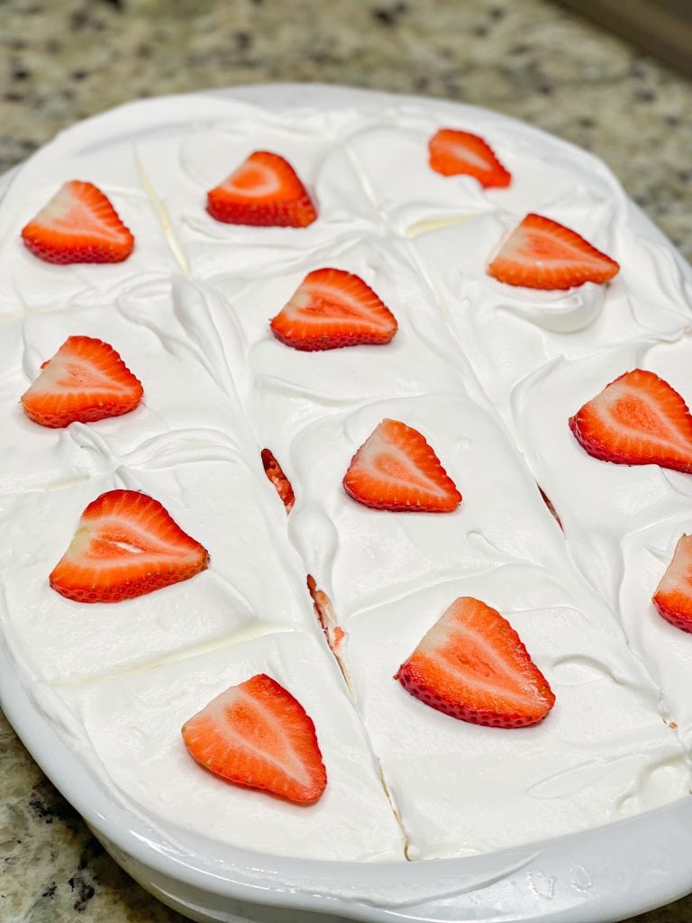 This Strawberry Shortcake Poke cake is so delicious, you won't believe it's just 3 main ingredients! The perfect cake for the summer.