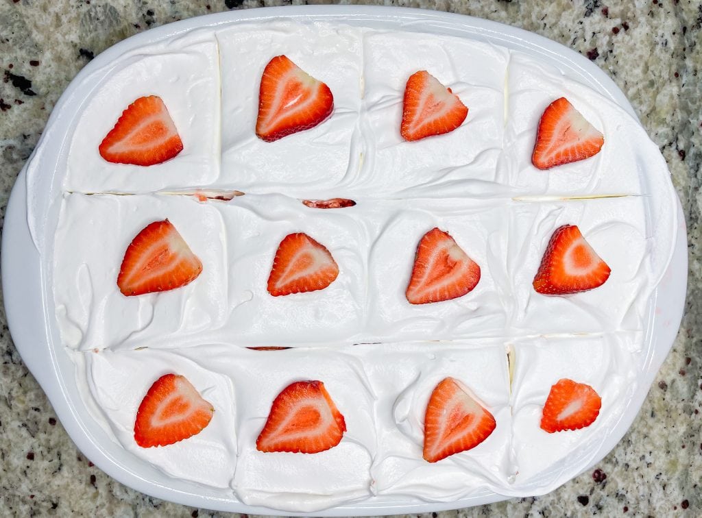 This Strawberry Shortcake Poke cake is so delicious, you won't believe it's just 3 main ingredients! The perfect cake for the summer.